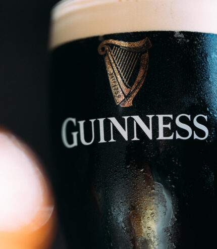 Refreshing pint of Guinness in hotel bar.
